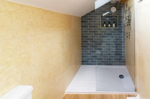 Rainfall shower at The Studio Cheddar with eco-friendly luxury toiletries — spa-inspired bathroom in a boutique Somerset self-catering lodge near Cheddar Gorge